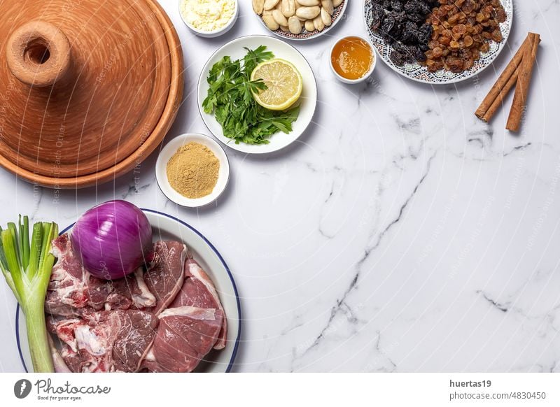 Raw ingredients and spices of traditional lamb stew or tagine background food white Moroccan meat lamb Arabic food aid Muslim halal tajine arabic morocco dinner