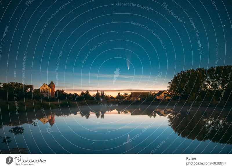 Dobrush, Belarus. Comet Neowise C2020f3 In Night Starry Sky Reflected In Small Lake Waters. C2020F3 beautiful belarus comet cosmic cosmos ethereal europe