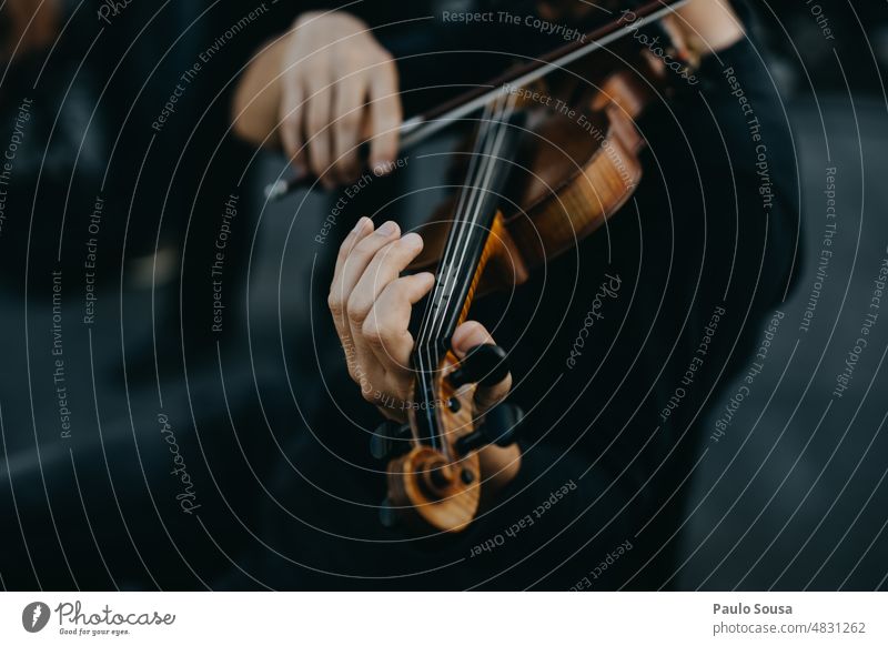 Man playing violin on stage Violin Violinist Music Musician Musical instrument Orchestra Stage Colour photo Detail Listen to music String instrument