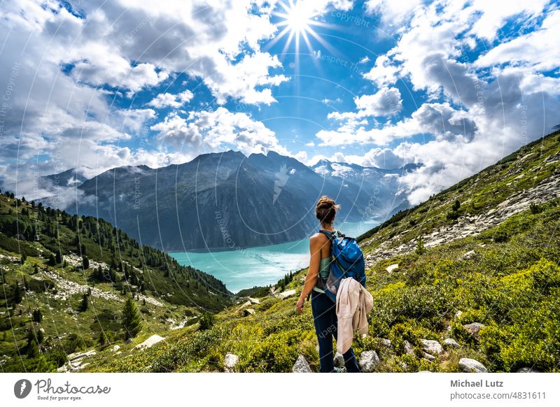 Hike to the Schlegeisspeicher to the Olperer Hütte Alps mountain lake away Eating Woman Hiking pants Pants Hut Karpos Lake Sun vacation hiking trousers wanderer
