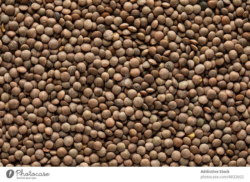 Heap of healthy lentils background legume culinary organic food raw uncooked seed product fresh natural ingredient cuisine healthy food many light heap pile