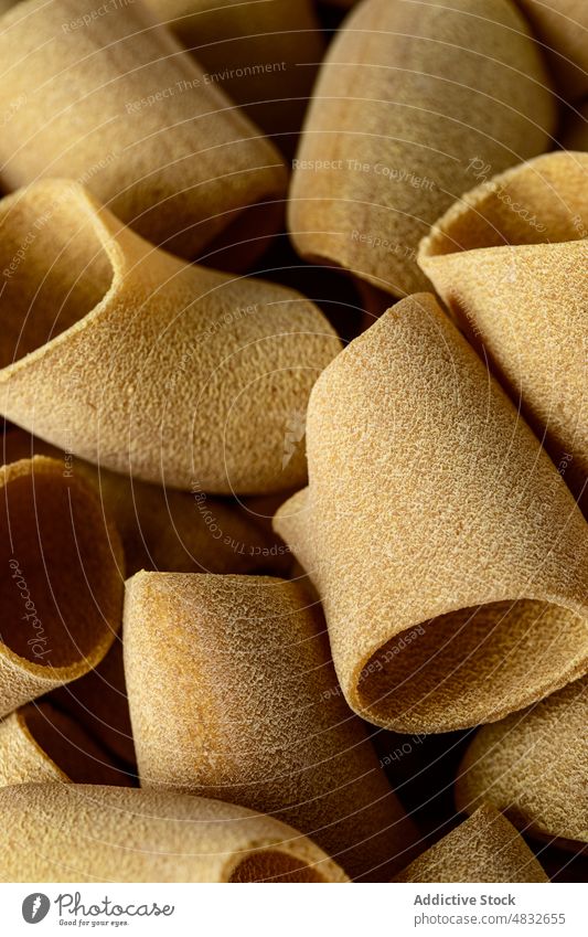 Raw paccheri pasta wholewheat raw heap cook mockup many food tradition italian nutrition ingredient meal cuisine dinner lunch dry organic dish uncooked culinary