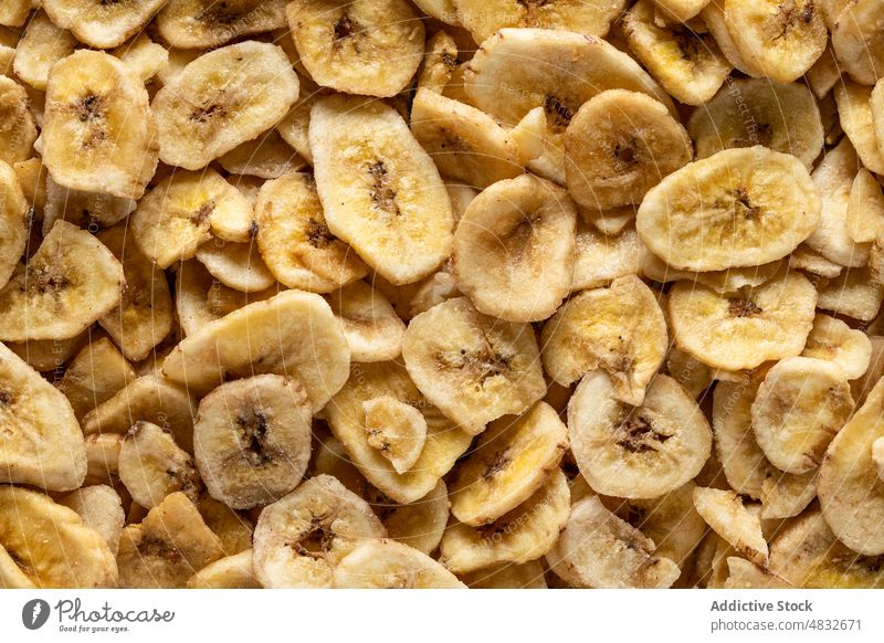 Close-up view of dried banana dry snack food chips fruit sweet nutrition healthy ingredient tasty diet organic closeup natural sliced yellow vegetarian