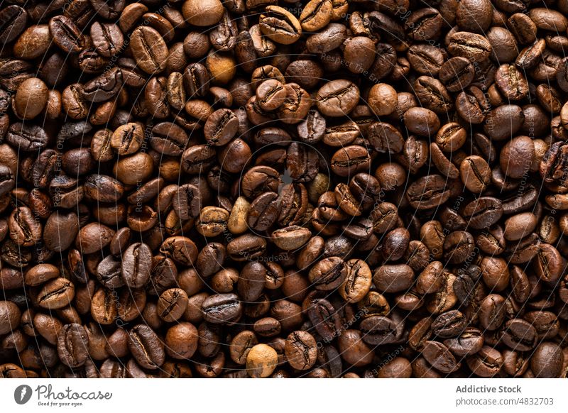 Background of roasted coffee beans with pleasant aroma toasted colombian background natural product organic ingredient dry abundance texture scent half heap
