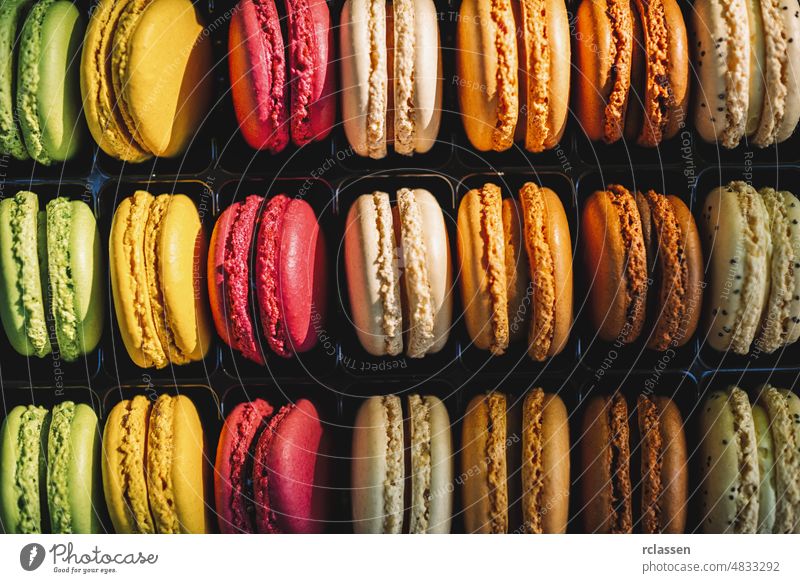Fresh bright colored Macarons, or macaroons. Different colorful macaroons in Tasty sweet color - Bakery concept image macaron bakery cake background dessert