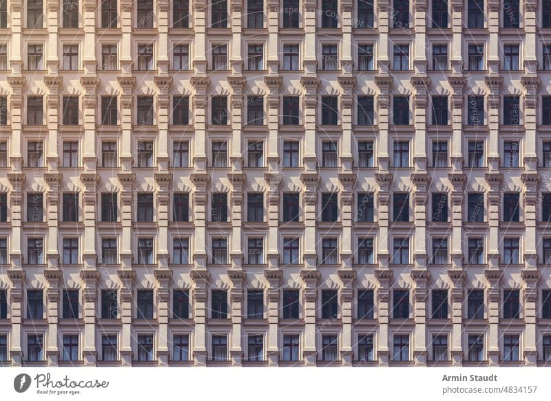architectural pattern, Berlin old building in beige with beautiful stucco seamless architecture facade repetition big huge many anonymous mega city future