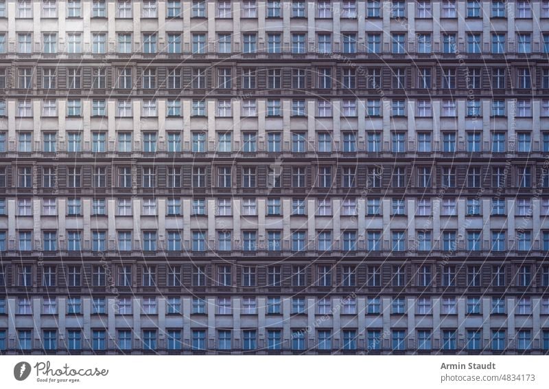 architectural pattern, gloomy old building facade of a berlin house with stucco seamless architecture repetition big huge many anonymous mega city future modern