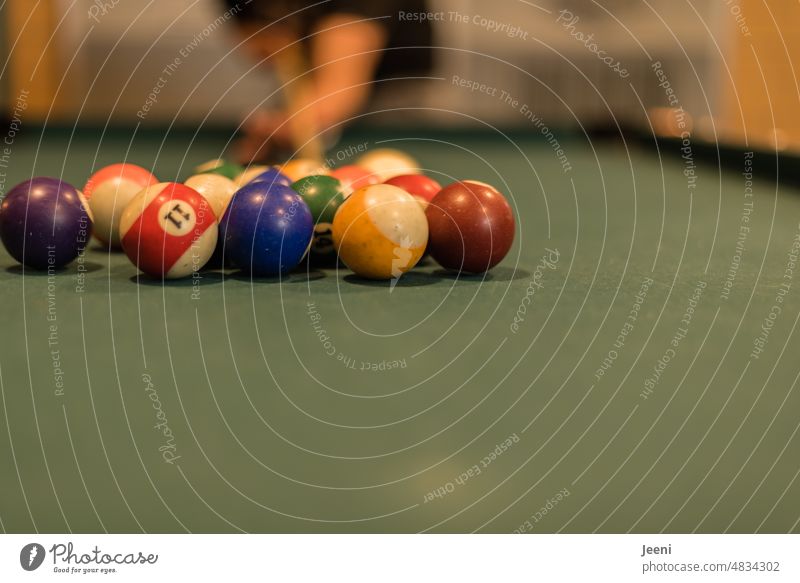Play billiards Pool (game) Billard bowle Sphere Round Many Green Queue Human being Table Hand Sports variegated free time Playing hobby fun activity Team