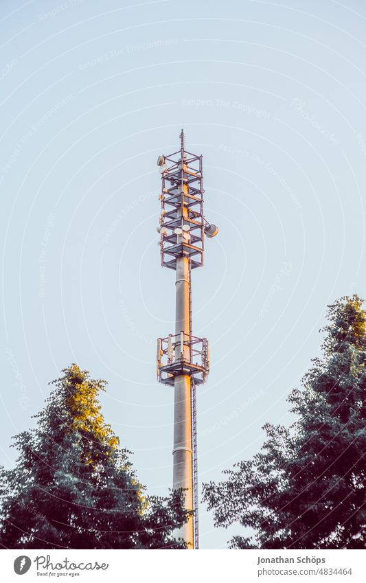 Radio mast for cell phone reception cell phone in front of blue sky 3G 4G 5g 5G Expansion 5G radiation Data protection digitization EMF Electromagnetic fields