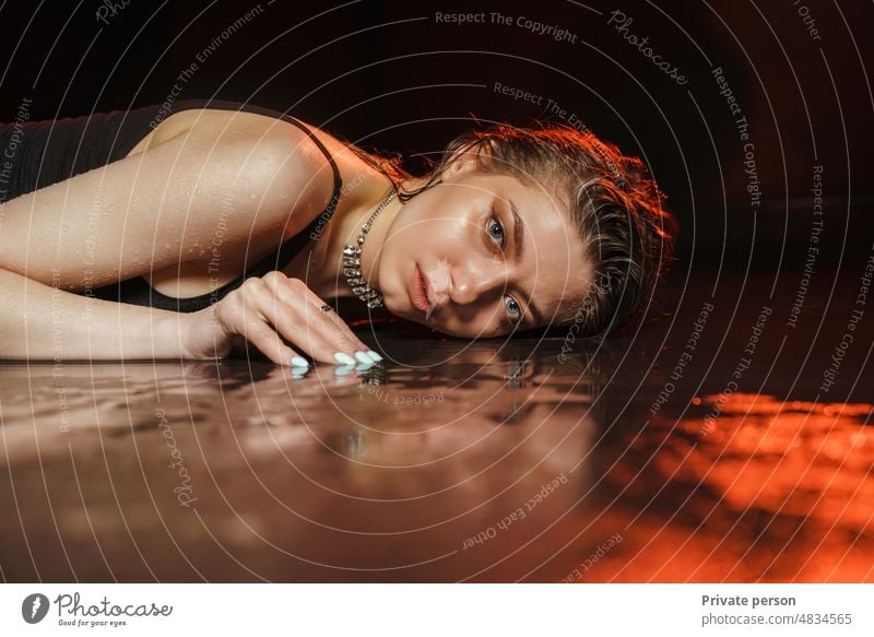 Fashion art photo of a girl, young beautiful woman lying in the water glamour wet lies Lying In Repose Abstract well-being Majestic Adult Water Hair Jewel