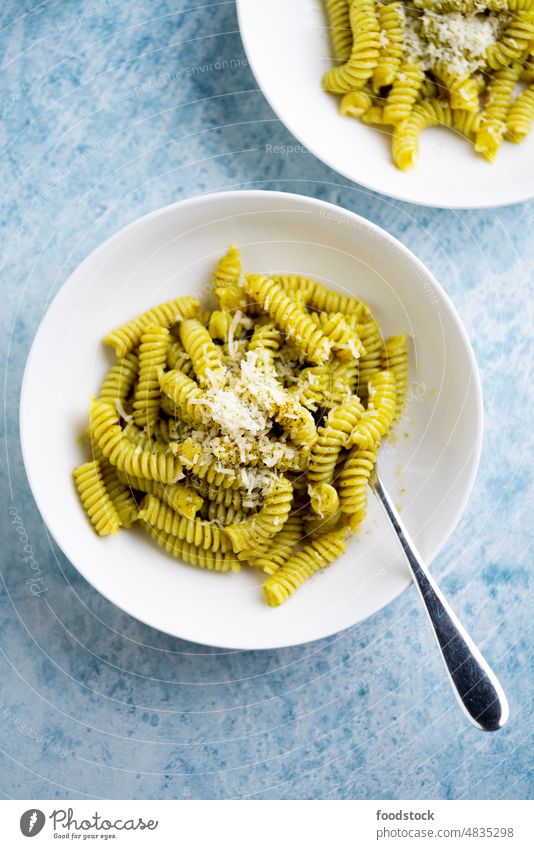 Plate of pasta with pesto Genovese, with fresh basil. Italy background bowl cheese cooked dinner dish food fusilli garlic green health healthy herb homemade
