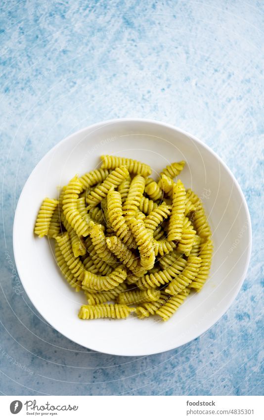 Plate of pasta with pesto Genovese, with fresh basil. Italy background bowl cheese cooked dinner dish food fusilli garlic green health healthy herb homemade