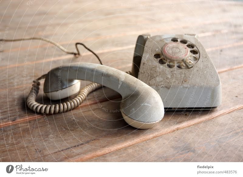 Stone Age Communication ancient antediluvian Telephone Rotary dial dusty Old Broken earpiece Past Retro Select Ancient Archaic plastic Receiver