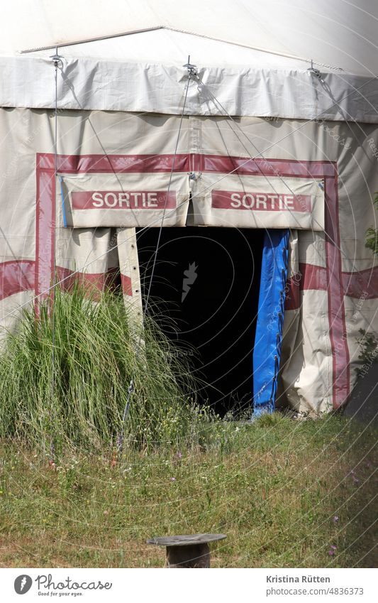 sortie from the circus tent sorty Way out Tent Circus tent Meadow Grass rear exit side exit artist exit Emergency exit Open open Event event Fairs & Carnivals