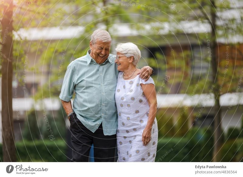 Senior couple in love walking in the park senior adult older aged portrait person casual leisure lifestyle pensioner caucasian retired people mature retirement