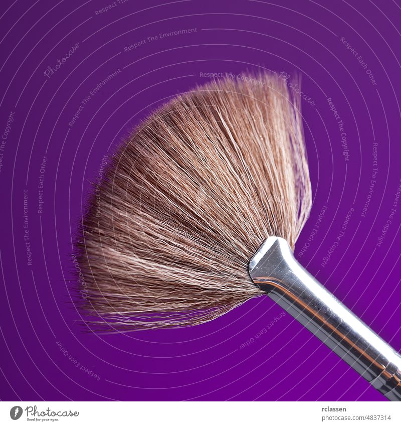 powderbrush on purple background beauty care cheeks color color picture cosmetics drogerie dust elegance eye eyes face fashion female glamour hair make-up