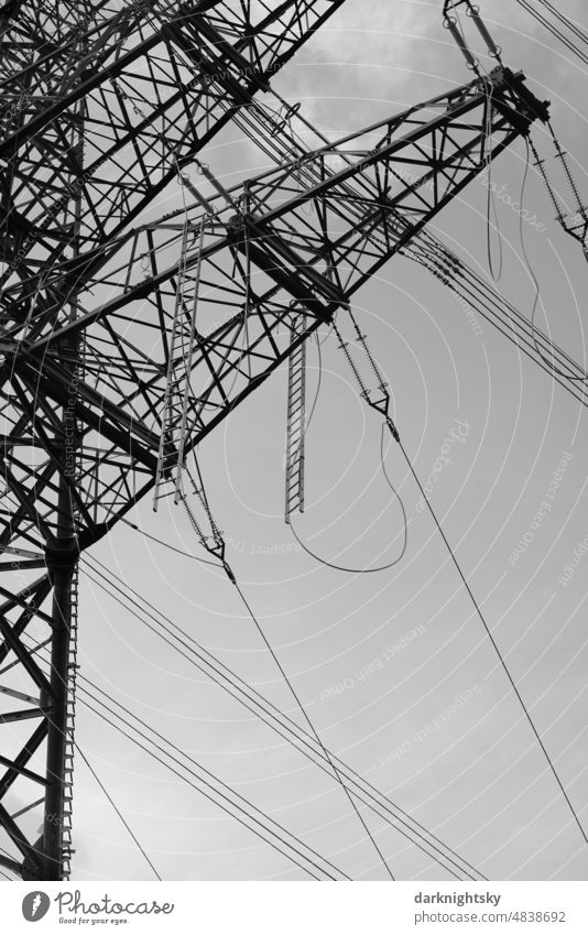 Detail of a line in the construction phase for the transport of high voltage with a steel mast transmission line pylon Deserted Transmission line