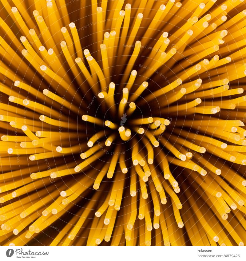 pasta noodles swirl Spaghetti bunch eat yellow long diet raw nutrition Italy carbohydrates uncooked food egg Italian macro durum wheat dough twister eddy