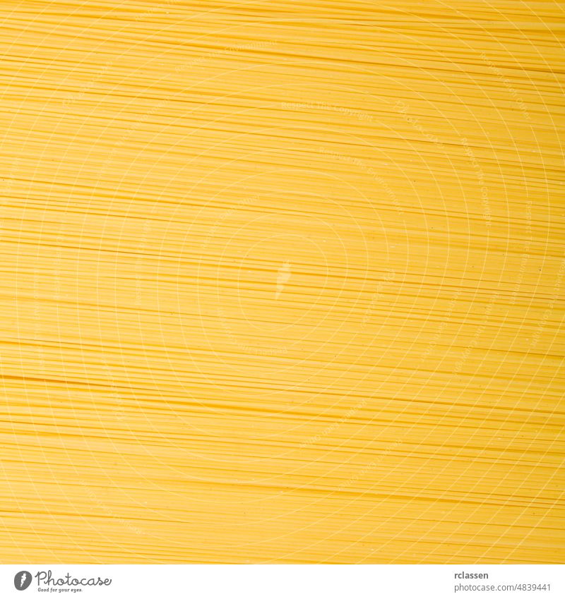 Spaghetti noodles texture background bunch eat yellow long diet raw nutrition Italy carbohydrates uncooked food egg Italian macro durum wheat pasta dough