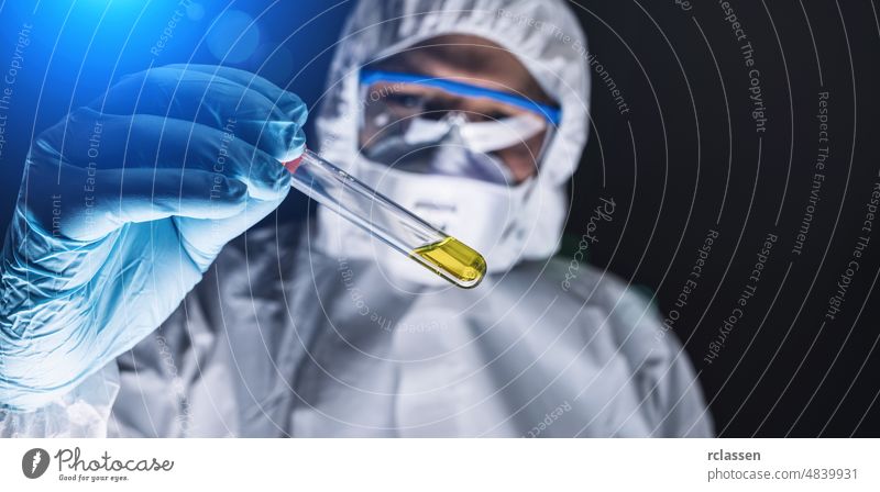 Scientist or doctor hold Invented vaccine against covid 19 or Coronavirus corona coronavirus hospital ebola mask protection analyzing lab laboratory epidemic