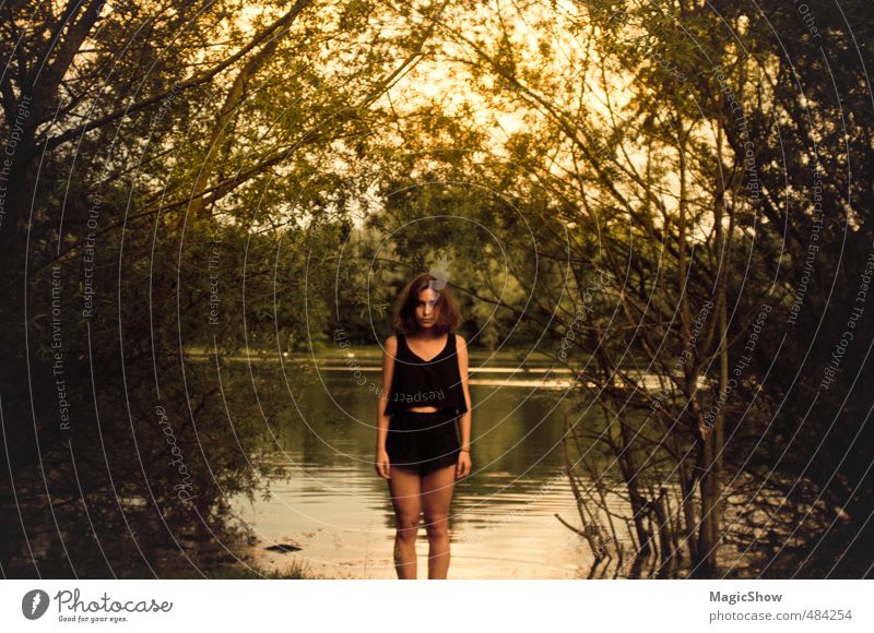 Woman at the pond Feminine Adults Skin 1 Human being Summer Warmth Garden Park Forest Bog Marsh Pond Lake Brunette Stand Leaf Dusk Green Yellow Hot pants