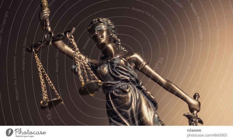 Statue of Lady Justice "Justitia" admonition attorney balance blind book bookshelf bronze business concept court court building courtroom crime debt female
