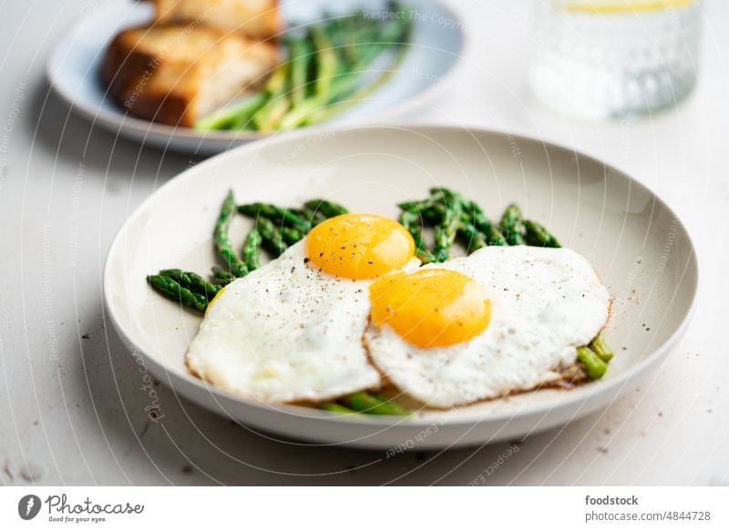 Fried eggs with green asparagus. Fast lunch ideas, healthy breakfast, summer food. brunch cooked cooking cuisine delicious diet dinner dish fresh fried homemade