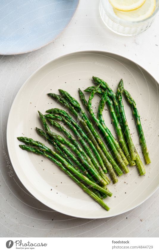 Grilled green asparagus on a a plate, top view. Summer above appetizer breakfast brunch bunch cook cooked cooking cuisine diet dinner dish eating food fresh