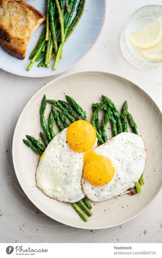 Fried eggs with green asparagus. Fast lunch ideas, healthy breakfast, summer food. above brunch cooked cooking cuisine delicious diet dinner dish fresh fried