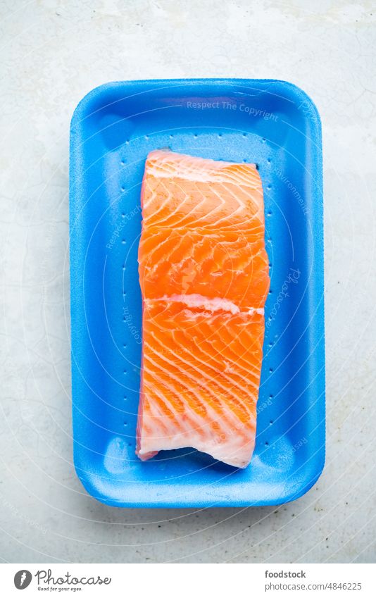Fresh raw salmon in plastic container, close up view. Atlantic Packaging blue cuisine diet dinner eat fillet fish food freshness gourmet healthy healthy eating