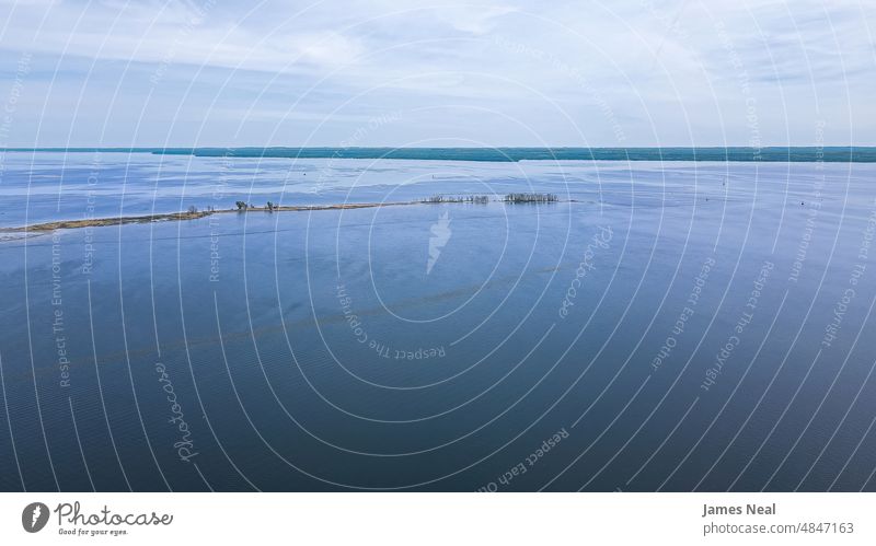 Spring day along outer edges of the bay of water horizon sunny sand color peaceful nature abstract beauty lake background summer beach wisconsin outdoors