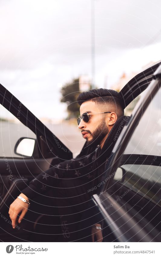 portrait of a young stylish bearded male Style styled styles Beard young adult youngster Looking away looking photogenic person personal photo pose poses posed