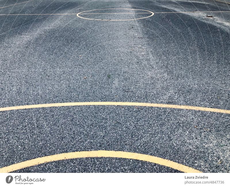 Basketball court and the yellow lines basketball court Sports Ball sports game Playing outdoors Wet Yellow street Street sports playing Exterior shot field