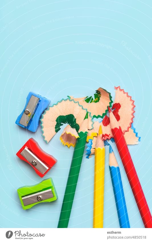 Top view of colored pencils, pencil sharpener and pencil shavings with space for text. Back to school concept education stationery back to school concept
