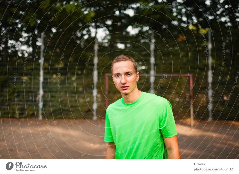 Young man on the football field with green T-shirt Fitness Sports Training Sportsperson soccer Football pitch Masculine Youth (Young adults) 1 Human being