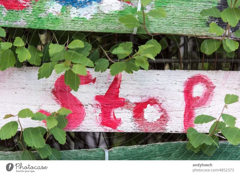 A painted stop on a wooden board abstract against aggression attention backdrop Background blur colorful communication concept conflict crisis danger design