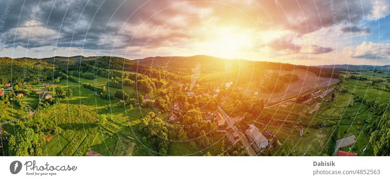 Aerial view of countryside area with village and mountains town aerial landscape suburb panorama summer field outdoor poland house nature above european rural