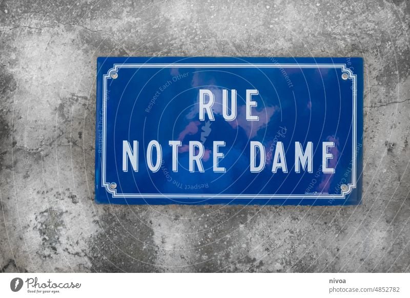 Street sign Rue Notre Dame Signs and labeling street sign rue notre dame Blue Wall (building) Wall (barrier) Structures and shapes reflection France Paris