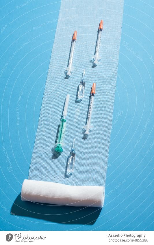Syringes and ampules on sterile bandage. Minimal medicine concept layout. ampoule syringe healthcare business clinic close up corona coronavirus cough covid 19