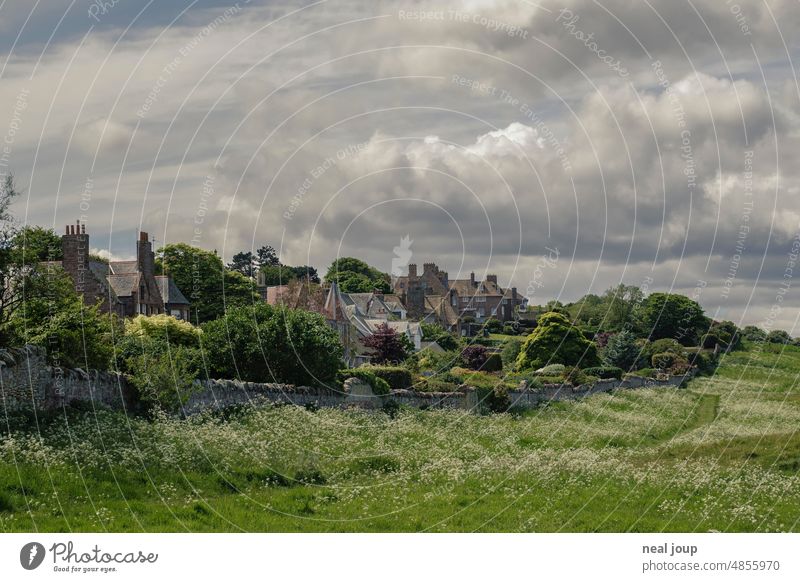 Dramatic cloudy sky over a picturesque Scottish village Landscape Nature Village Scotland Hill Clouds in the sky Gray Green Weather Dark Thunder and lightning