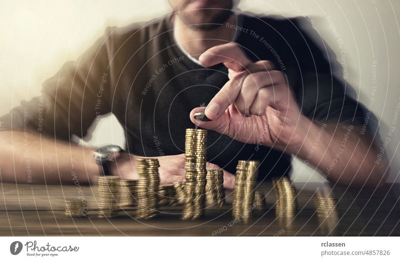 man rising coins on stacks money investment business finance growth concept cash currency gold financial bank banking stacked economy pile dollar rich euro