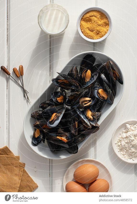 Fresh mussels in a bowl on wooden table spanish tapas tapas food shell mussel shell food background stuffed dinner mediterranean cook tasty dish seafood meal