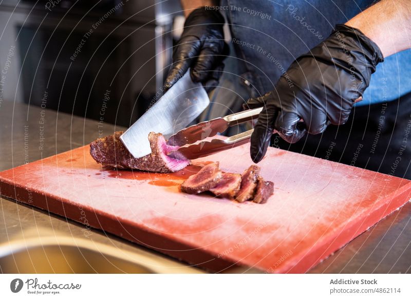 Chef Hands Cut Grill Steak At Kitchen Restaurant Cutting Knife Cutting Board Tongs Glove Holding Meat Cooked Food Bowl Commercial Cooking Industrial Dish