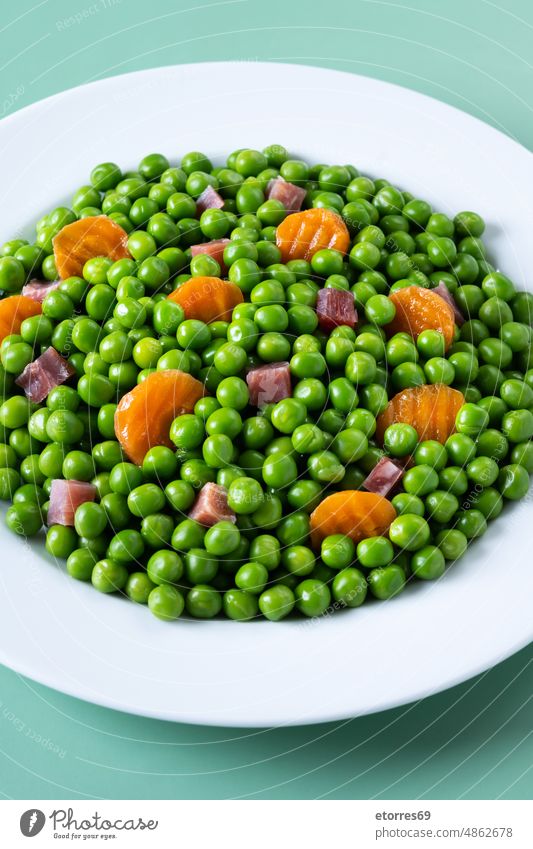 Green peas, serrano ham and carrot cooked dinner food green healthy lunch mix spanish vegetable