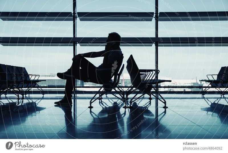 businessman waiting for the flight Airport Business trip People international travel commuter abstract architecture Luggage entrepreneur chair aviator Glass