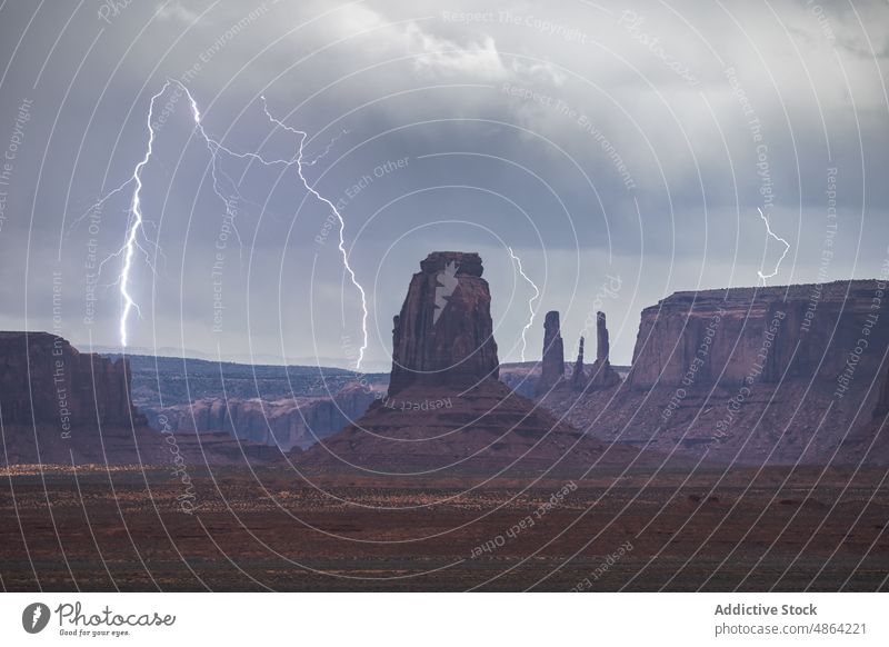 Scenic from above view of mountain under thunderstorm sky cliffs utah Arizona national park landscape Monument Valley cloudy travel butte rocky outcrop