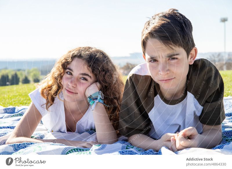 Brother And Sister Lying On Picnic Blanket mother Sunny Family Sibling Together Lifestyle Leisure Bonding Sunlight Relax Casual Portrait Looking Weekend Boy