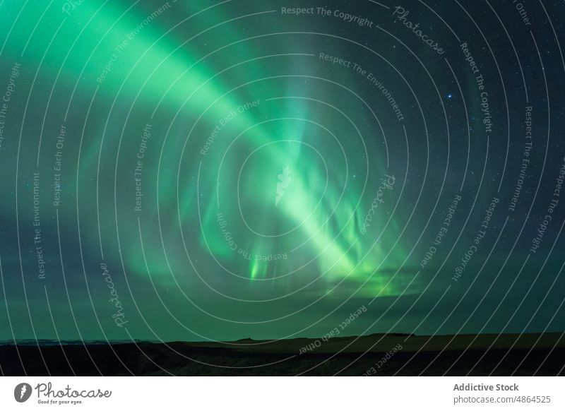 Amazing view of northern lights in night sky aurora borealis mountain winter polar glow starry illuminate phenomenon scenic picturesque dark spectacular green