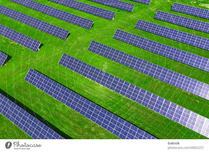 Solar panels in green field, aerial view solar energy photovoltaic renewable sustainable battery power technology clean solar panel solar battery clean energy
