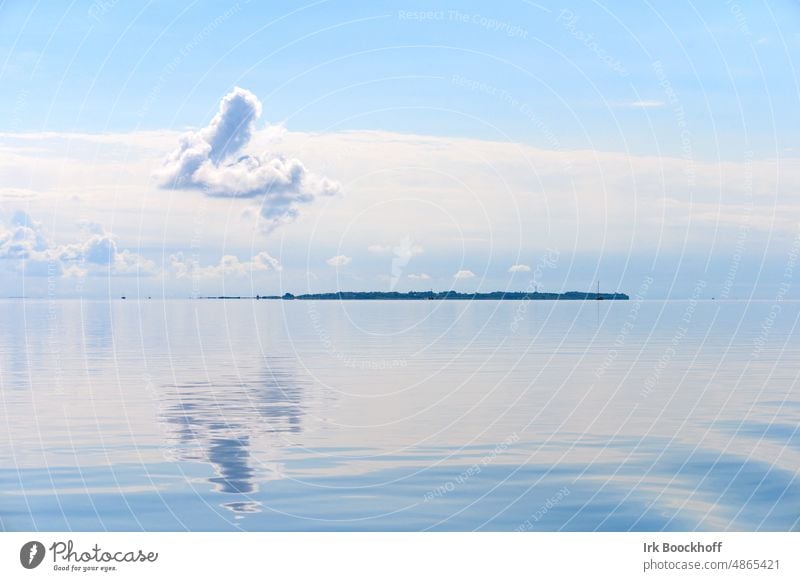 Cloud over an island reflected on a windless day silent Illuminate Sunlight Light wide Element water Peaceful Water reflection Longing Recreation by the water